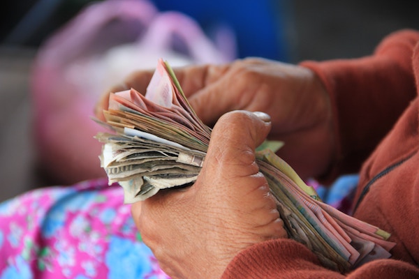 Person counting money, ari monkarsh philanthropy fundraising